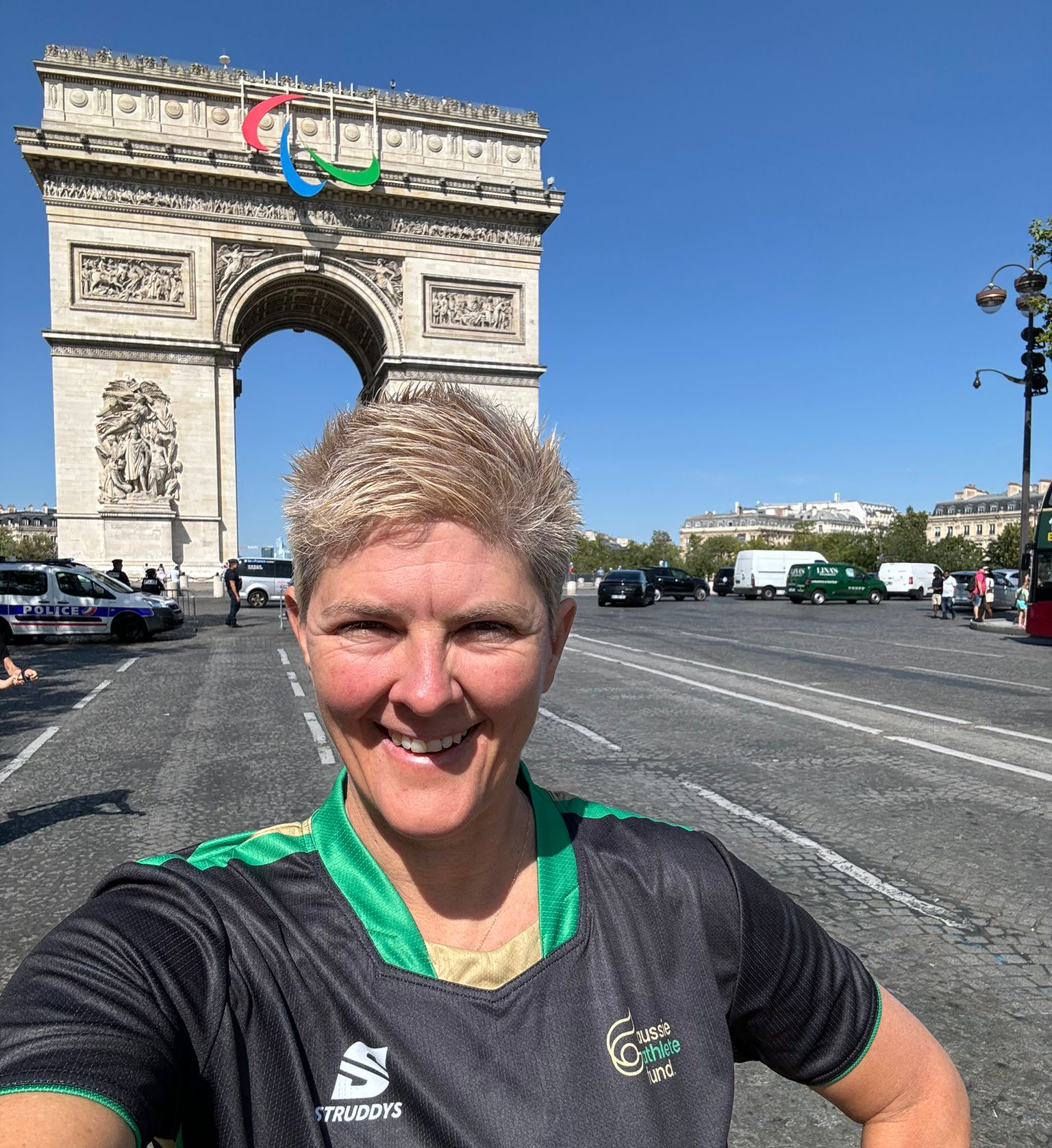 Nat Cook OAM OLY taking a selfie in front of the Eiffel Tower at the Paris 2024 Paralympic Agitos on the Arc de Triomphe in Paris