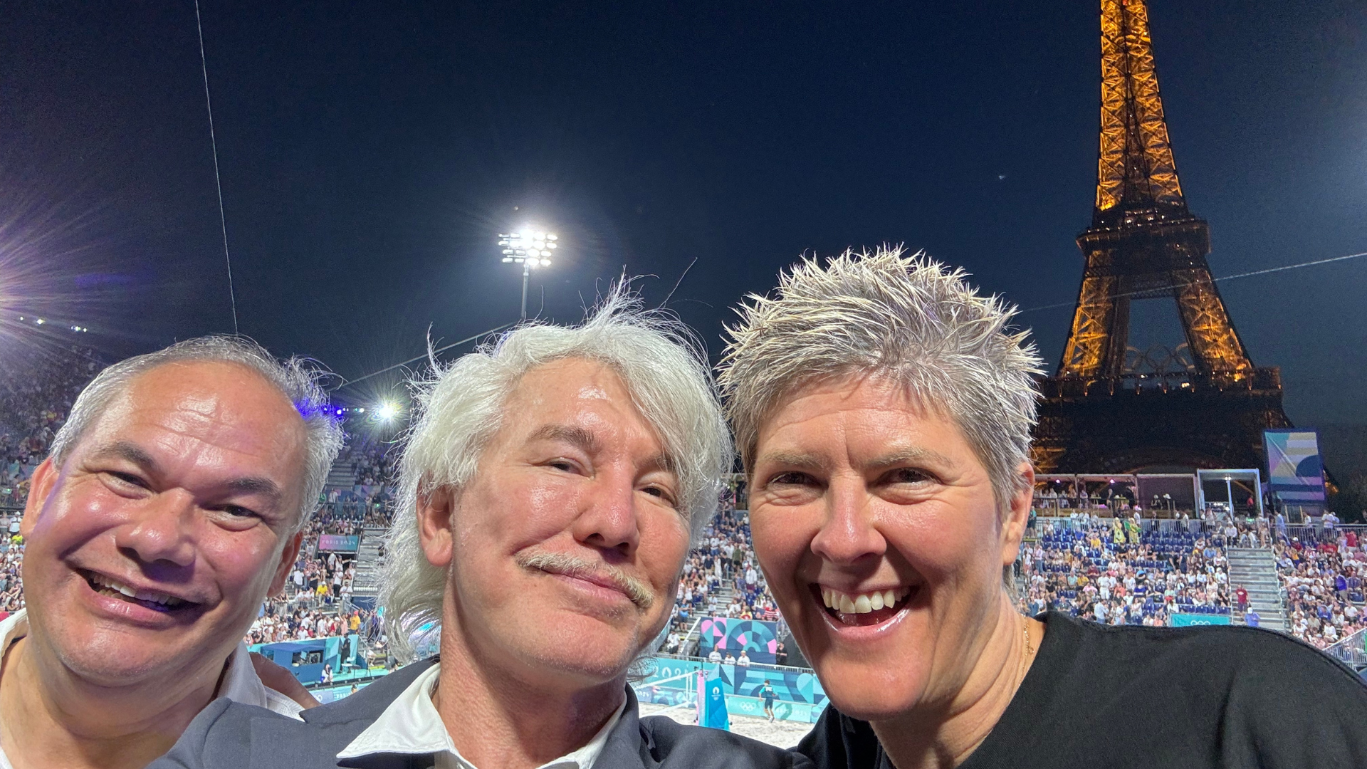 Nat Cook watching beach volleyball under the Eiffel Tower in Paris 2024 with Baz Luhrmann