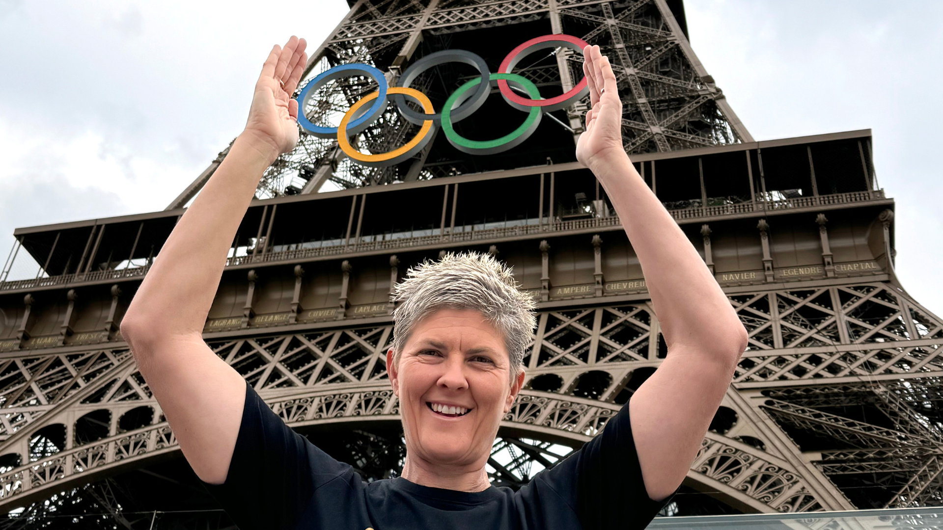 Olympian Nat Cook OAM OLY under the Eiffel Tower at the Paris 2024 Olympic Games