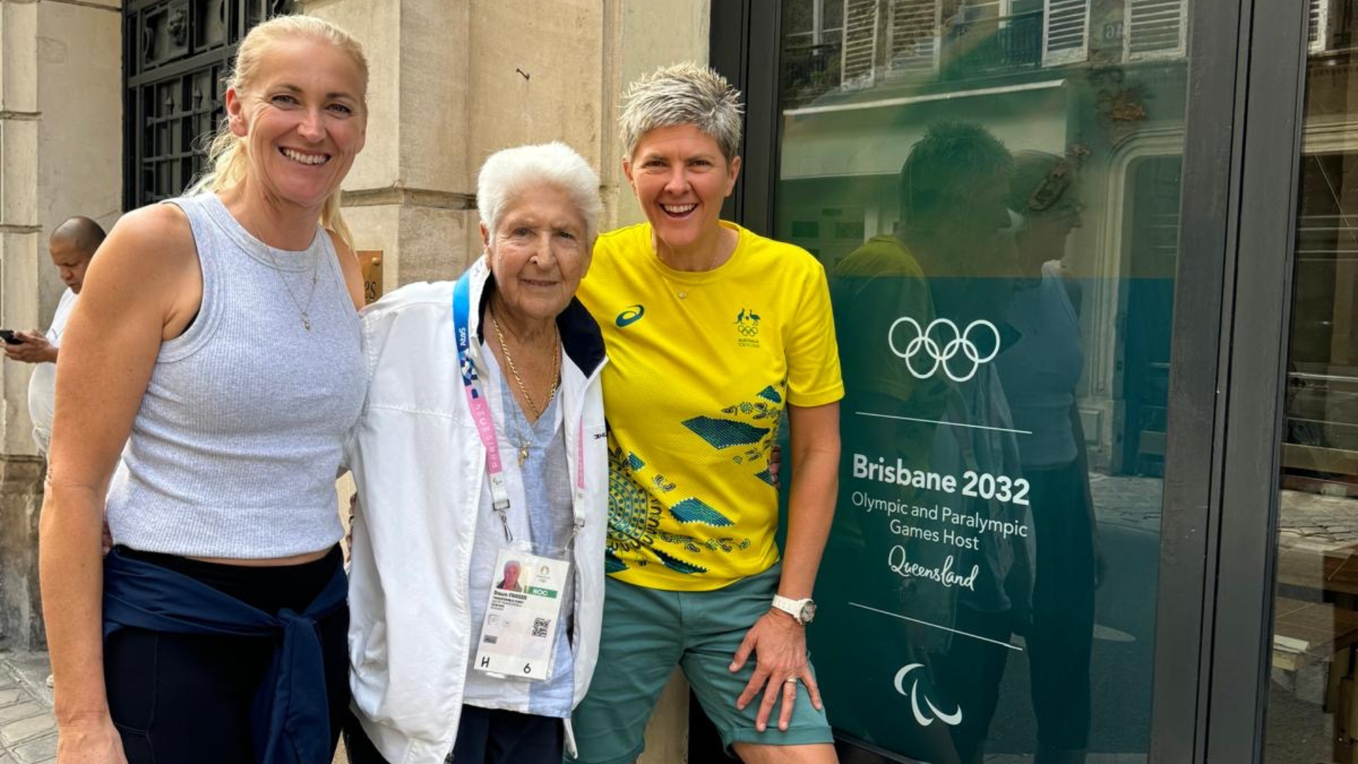 Kerri Pottharst Dawn Fraser and Nat Cook outside the Brisbane 2032 Olympic and Paralympic Games Host sign in Paris 2024