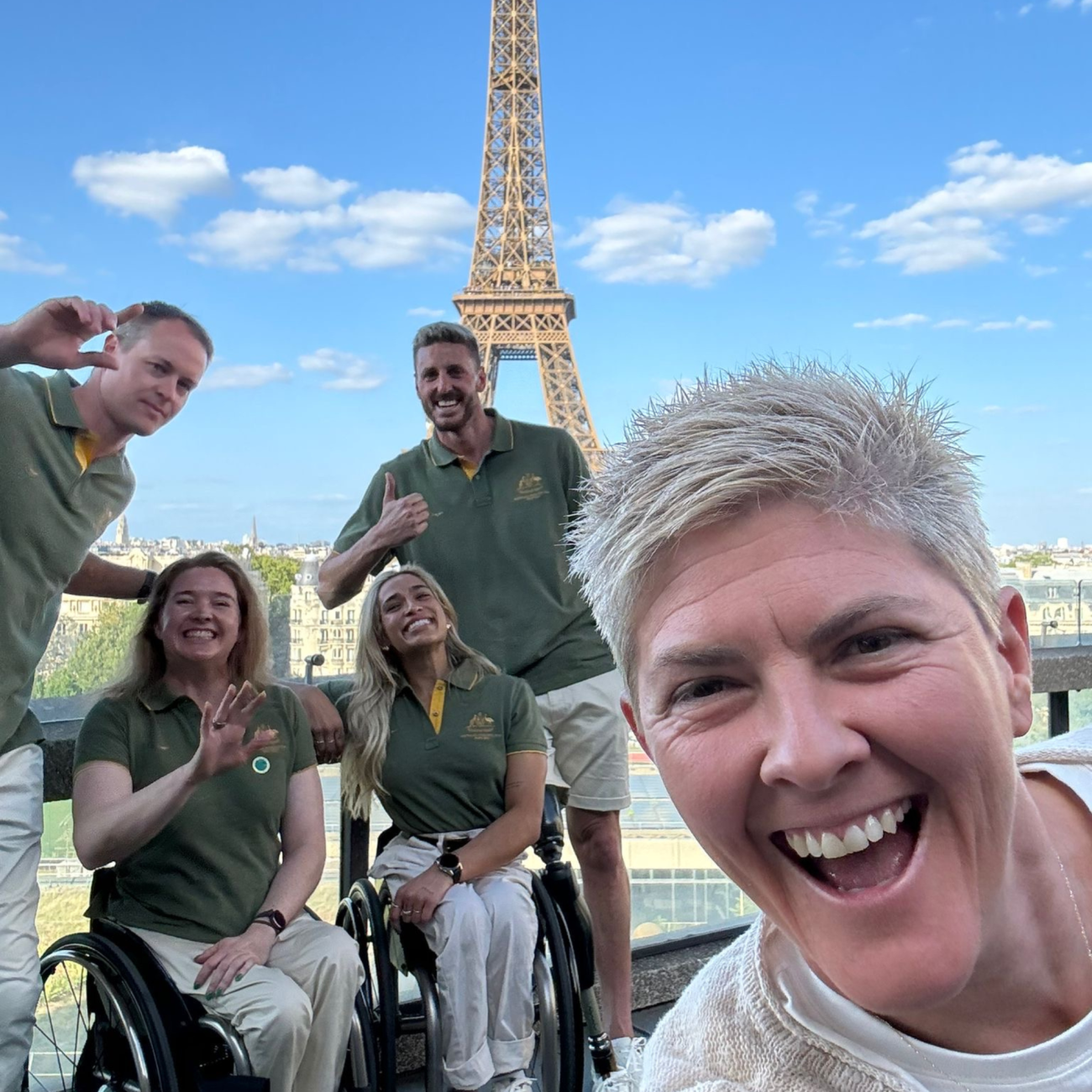 Nat Cook OAM OLY with Australian Paralympians Curtis McGrath, Angie Ballard, Madison de Rozario and Brenden Hall, posing in front of the Eiffel Tower at the Paris 2024 Paralympics welcome event